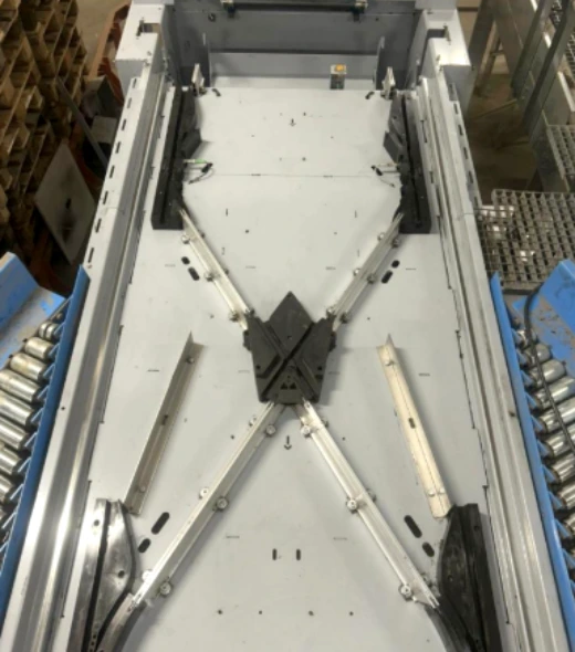 Overhead view of a clean automated conveyor diverter structure for a complex parcel sorting system.